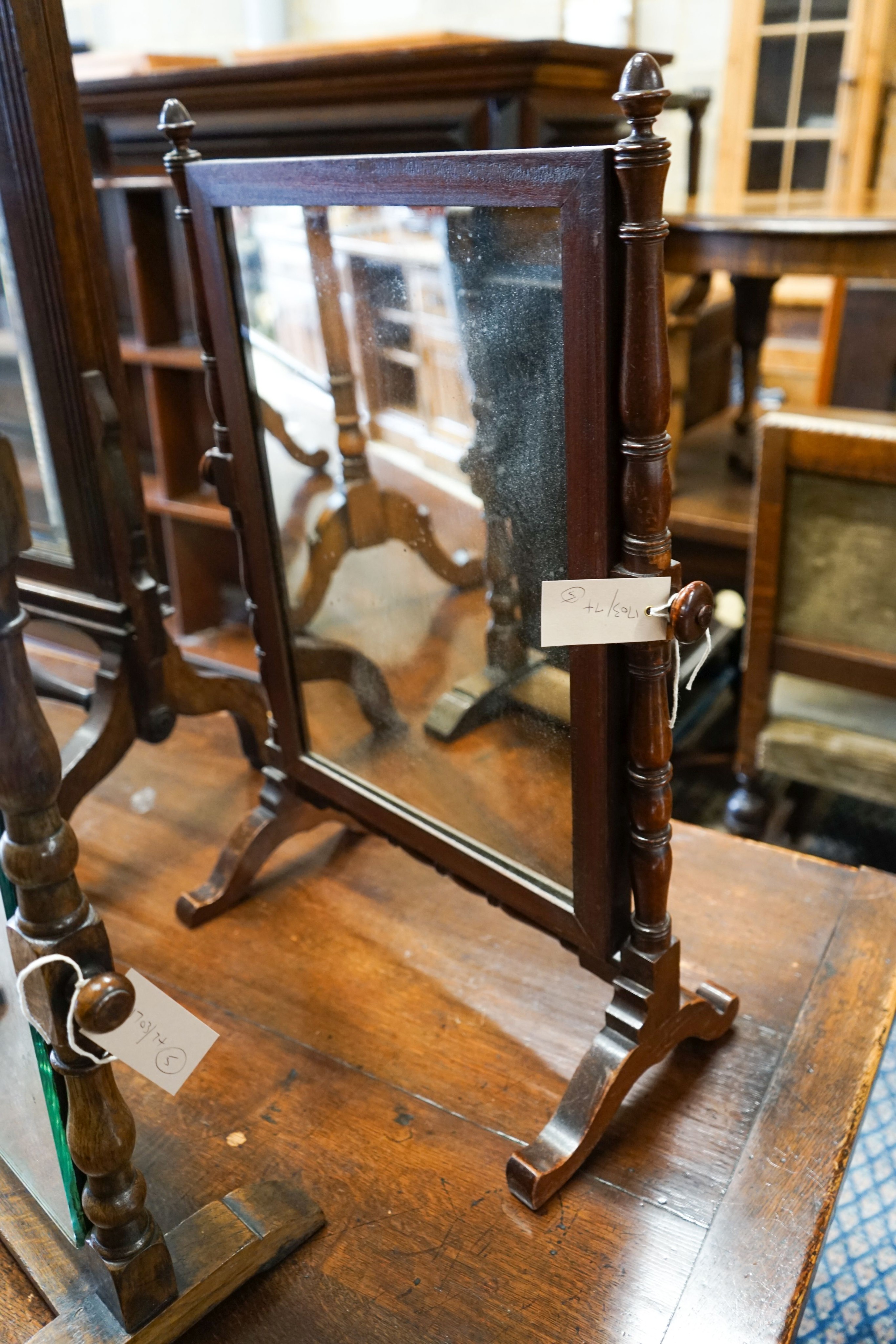 An oak triple mirror, a towel rail, an oak firescreen and two toilet mirrors